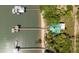 Aerial image capturing waterfront homes with private docks, revealing beautiful beach access and greenery at 2619 Buccaneer Rd, Isle of Palms, SC 29451