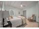 This bedroom features a window, a full bed, and a ceiling fan providing comfort and natural light at 2619 Buccaneer Rd, Isle of Palms, SC 29451