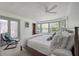 Serene bedroom with ceiling fan, a cozy window seat, and plenty of natural light at 2619 Buccaneer Rd, Isle of Palms, SC 29451