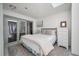 A clean bedroom with lots of natural light, a full size bed, and dresser with view of outdoors at 2619 Buccaneer Rd, Isle of Palms, SC 29451
