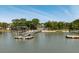 Exterior view of waterfront property with private dock and beach access surrounded by mature trees at 2619 Buccaneer Rd, Isle of Palms, SC 29451