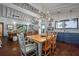Kitchen and Dining area with modern appliances, stylish lighting, and an open layout to the living room at 2619 Buccaneer Rd, Isle of Palms, SC 29451