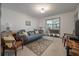 Cozy living room with neutral tones, comfortable seating, and a view to the porch at 2619 Buccaneer Rd, Isle of Palms, SC 29451