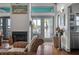 Living room details with a fireplace, French doors, and a view of the water at 2619 Buccaneer Rd, Isle of Palms, SC 29451