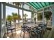 Enjoy the scenic views from this charming outdoor patio with a large table and comfortable seating for all your guests at 2619 Buccaneer Rd, Isle of Palms, SC 29451