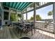 Relaxing outdoor patio with seating for ten, offering an open-air dining experience and beautiful natural views at 2619 Buccaneer Rd, Isle of Palms, SC 29451