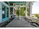 Inviting outdoor patio showcasing a spacious dining table with seating and a scenic view of the surrounding landscape at 2619 Buccaneer Rd, Isle of Palms, SC 29451