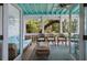 Relaxing screened porch with comfortable seating and serene views of the surrounding nature at 2619 Buccaneer Rd, Isle of Palms, SC 29451