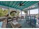 Inviting screened porch with waterfront views, perfect for outdoor dining and relaxation at 2619 Buccaneer Rd, Isle of Palms, SC 29451