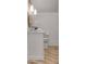 Half bathroom featuring vanity and wood-look floor at 27 Watroo Pt, Daniel Island, SC 29492
