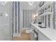 Modern bathroom with stylish wallpaper and vanity at 27 Watroo Pt, Daniel Island, SC 29492