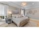 Serene primary bedroom with soft colors, decorative accents, and hardwood floors at 27 Watroo Pt, Daniel Island, SC 29492