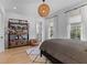 Bedroom boasts hardwood floors, decorative lighting, and a cozy reading nook perfect for a relaxing retreat at 27 Watroo Pt, Daniel Island, SC 29492