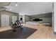 Spacious bonus room featuring a home gym and entertainment area with a large sectional sofa at 27 Watroo Pt, Daniel Island, SC 29492