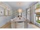Elegant dining area with a marble table, stylish chairs, and sophisticated decor is perfect for formal gatherings and entertaining at 27 Watroo Pt, Daniel Island, SC 29492