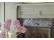 Close-up of a modern fireplace with marble surround and decorative molding at 27 Watroo Pt, Daniel Island, SC 29492