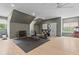This exercise room includes a treadmill, stationary bike, weights, and a ceiling fan at 27 Watroo Pt, Daniel Island, SC 29492