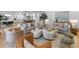 Open-concept living room features stylish furnishings, a cozy atmosphere, and natural light throughout the space for comfortable living at 27 Watroo Pt, Daniel Island, SC 29492