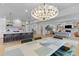 Open-concept layout seamlessly connects the kitchen, dining, and living areas, perfect for entertaining and modern living at 27 Watroo Pt, Daniel Island, SC 29492