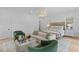 Spacious main bedroom with seating area, wood floors, rug, sofa and two chairs at 27 Watroo Pt, Daniel Island, SC 29492