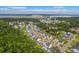 Aerial view highlighting the community amenities including a fishing pond, nature trail, pool, and dock at 2710 Mcfadden Way, Johns Island, SC 29455