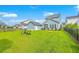 Expansive backyard with green grass and outdoor seating area at 2710 Mcfadden Way, Johns Island, SC 29455
