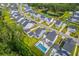 Aerial shot of backyard with a pool, lounge area, bordered by trees, defining property lines at 2710 Mcfadden Way, Johns Island, SC 29455
