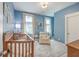 Bright Bedroom with blue walls, crib, area rug, and natural light at 2710 Mcfadden Way, Johns Island, SC 29455
