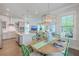 Bright dining area adjacent to the kitchen featuring stylish lighting and green accented chairs at 2710 Mcfadden Way, Johns Island, SC 29455