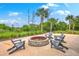 Outdoor fire pit area with Adirondack chairs, perfect for gatherings and relaxation at 2710 Mcfadden Way, Johns Island, SC 29455