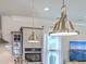 Kitchen lighting featuring stainless steel pendant lights and stainless steel appliances at 2710 Mcfadden Way, Johns Island, SC 29455