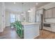 Modern kitchen featuring stainless steel appliances, white countertops, gray cabinets, and an island at 2710 Mcfadden Way, Johns Island, SC 29455