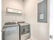 Laundry area with modern washer and dryer units and ample space at 2710 Mcfadden Way, Johns Island, SC 29455