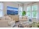 Bright living room with comfortable seating, large windows, and a decorative entertainment center at 2710 Mcfadden Way, Johns Island, SC 29455