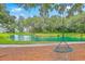 Picturesque pond featuring a rope swing, complemented by mature trees draped in Spanish moss at 2710 Mcfadden Way, Johns Island, SC 29455