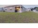 Well-maintained backyard featuring a covered patio with grill and ample lawn space for outdoor enjoyment at 286 W Bradford Pointe Dr, Summerville, SC 29486