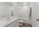 Bathroom with a modern sink vanity, a full bathtub, and stylish wood-look flooring at 286 W Bradford Pointe Dr, Summerville, SC 29486