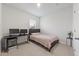 Bright bedroom with a cozy bed, a sleek desk setup, and a neutral color scheme at 286 W Bradford Pointe Dr, Summerville, SC 29486