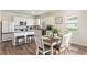 Bright dining area features hardwood flooring, a decorative table setting, and lots of natural light at 286 W Bradford Pointe Dr, Summerville, SC 29486