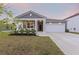 Charming single-story home with a welcoming front porch and a well-manicured lawn at 286 W Bradford Pointe Dr, Summerville, SC 29486