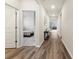 Hallway features hardwood floors and leads to bedrooms and the living area at 286 W Bradford Pointe Dr, Summerville, SC 29486