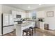 Modern kitchen with white cabinets, granite countertops, and stainless steel appliances at 286 W Bradford Pointe Dr, Summerville, SC 29486