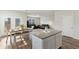 Open concept kitchen with island, dining table, and views of the living area at 286 W Bradford Pointe Dr, Summerville, SC 29486
