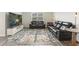 Cozy living room features a large TV, comfortable seating, and modern decor at 286 W Bradford Pointe Dr, Summerville, SC 29486