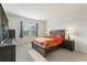 Bright main bedroom featuring a wooden bed frame, bedside tables, and lots of natural light at 286 W Bradford Pointe Dr, Summerville, SC 29486