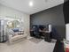 Bright office with a dark accent wall, a large window, and comfortable seating area at 286 W Bradford Pointe Dr, Summerville, SC 29486