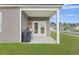 Enjoy outdoor living on this covered patio with grill, perfect for entertaining and relaxing at 286 W Bradford Pointe Dr, Summerville, SC 29486