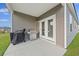 Covered patio with grill, perfect for outdoor cooking and entertaining with easy access from inside at 286 W Bradford Pointe Dr, Summerville, SC 29486