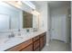 Bright bathroom features a dual sink vanity with granite countertops, and a walk-in tiled shower at 302 Fiddleback Dr, Summerville, SC 29486