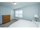 Neutral bedroom with a chest of drawers, carpet, window, and crisp white bedding for a calming atmosphere at 302 Fiddleback Dr, Summerville, SC 29486